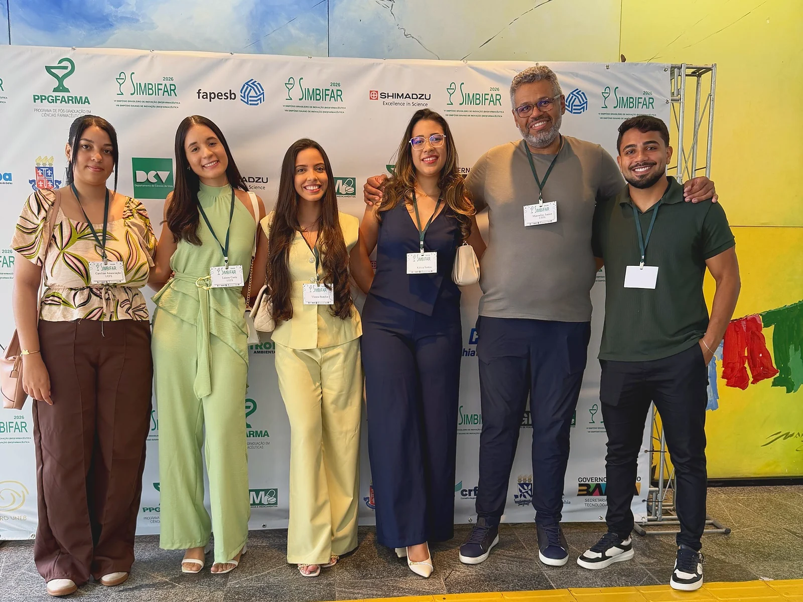 Equipe do LMM em frente ao painel do SIMBIFAR 2026